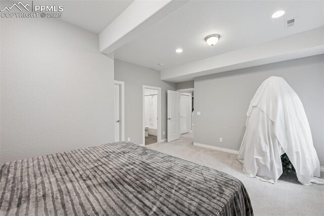 6949 Compass Bend Dr, Colorado Springs, CO 80927 - carpeted bedroom featuring baseboards, recessed lighting, and connected bathroom