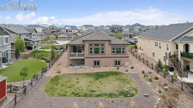 6949 Compass Bend Dr, Colorado Springs, CO 80927 - back of property with a residential view, stairs, and stucco siding