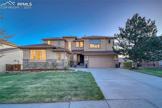 15872 Maple Hill Rd, Monument, CO 80132 - prairie-style home with stucco siding, an attached garage, stone siding, and concrete driveway