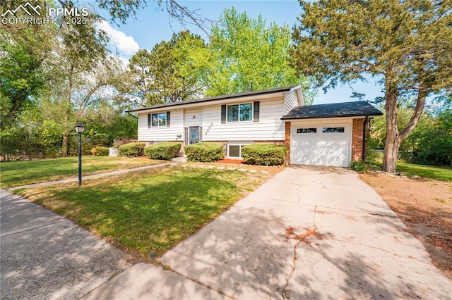 2506 Templeton Gap Rd, Colorado Springs, CO 80907 - split foyer home featuring brick siding, a front lawn, driveway, and a garage