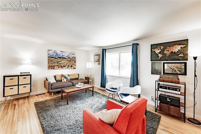 2506 Templeton Gap Rd, Colorado Springs, CO 80907 - living area featuring wood finished floors and baseboards