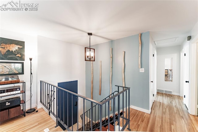 2506 Templeton Gap Rd, Colorado Springs, CO 80907 - hall featuring an upstairs landing, light wood-type flooring, and baseboards