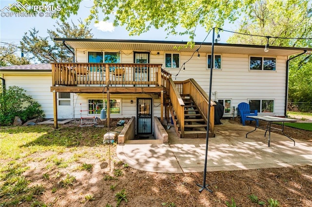 2506 Templeton Gap Rd, Colorado Springs, CO 80907 - rear view of house featuring stairway, a patio, and a wooden deck
