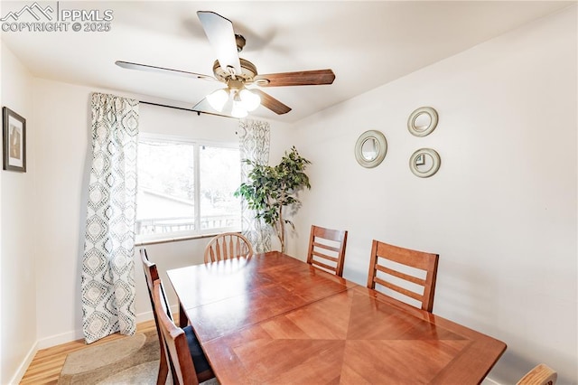 2506 Templeton Gap Rd, Colorado Springs, CO 80907 - dining area with a ceiling fan, wood finished floors, and baseboards