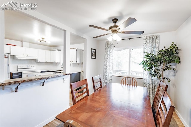 2506 Templeton Gap Rd, Colorado Springs, CO 80907 - dining room with a ceiling fan and light wood-style floors