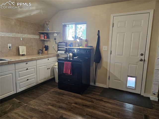 46 Sunflower Rd, Colorado Springs, CO 80907 - kitchen with black electric range oven, dark wood-type flooring, white cabinets, lofted ceiling, and light countertops