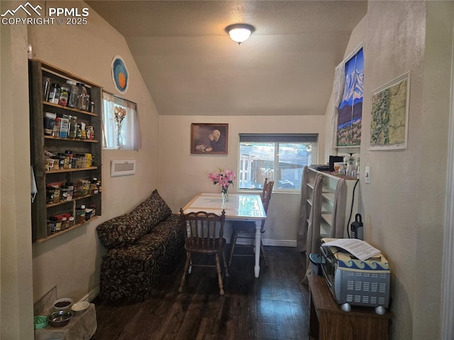 46 Sunflower Rd, Colorado Springs, CO 80907 - dining room with lofted ceiling, wood finished floors, and baseboards