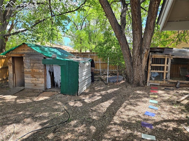 46 Sunflower Rd, Colorado Springs, CO 80907 - view of yard with exterior structure, fence, and an outdoor structure