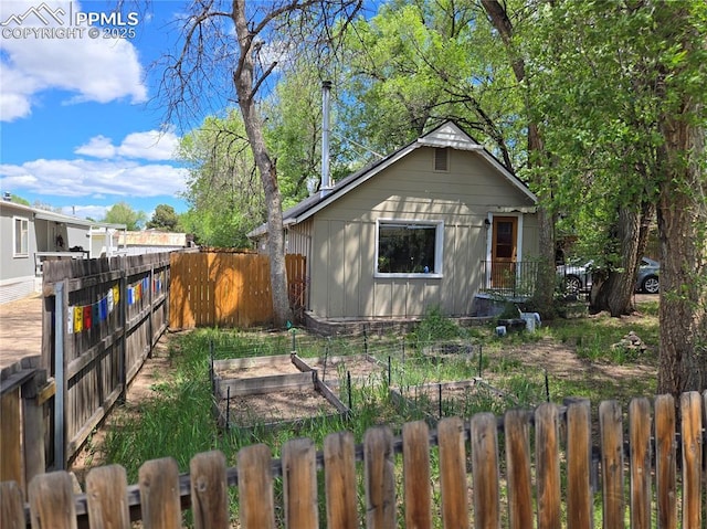 46 Sunflower Rd, Colorado Springs, CO 80907 - view of front facade featuring a vegetable garden