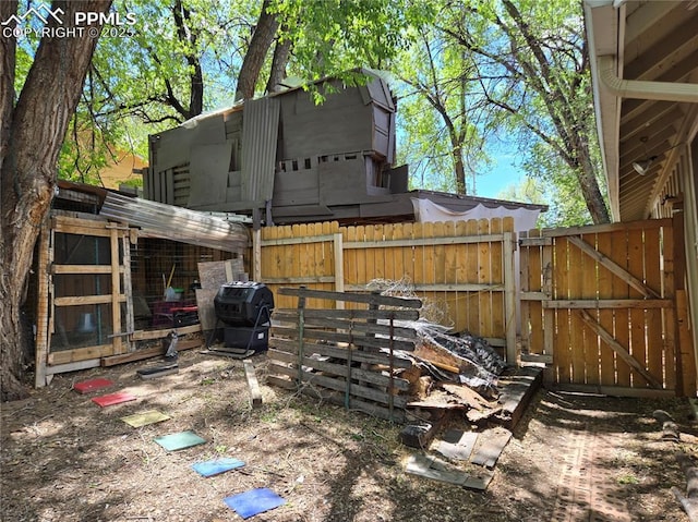 46 Sunflower Rd, Colorado Springs, CO 80907 - view of yard featuring fence, a gate, and exterior structure