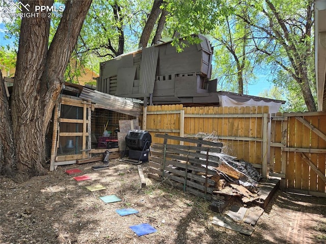 46 Sunflower Rd, Colorado Springs, CO 80907 - view of yard with exterior structure, fence, and a gate