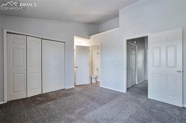 514 Shady Crest Cir, Colorado Springs, CO 80916 - unfurnished bedroom featuring vaulted ceiling, a textured ceiling, carpet floors, a closet, and baseboards