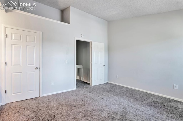 514 Shady Crest Cir, Colorado Springs, CO 80916 - unfurnished bedroom with carpet flooring, a textured ceiling, and baseboards