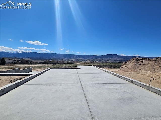 view of patio / terrace with a mountain view