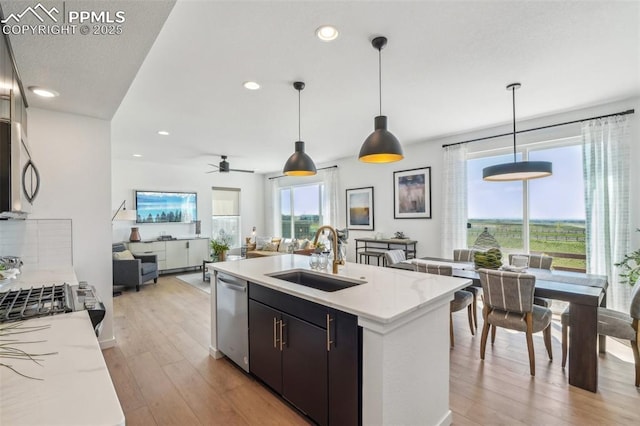 6913 Knapp Dr, Colorado Springs, CO 80924 - kitchen featuring a sink, appliances with stainless steel finishes, light wood-style flooring, open floor plan, and recessed lighting