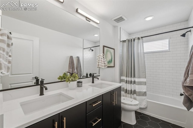 6913 Knapp Dr, Colorado Springs, CO 80924 - full bathroom with shower / bath combination with curtain, double vanity, toilet, and tile patterned floors