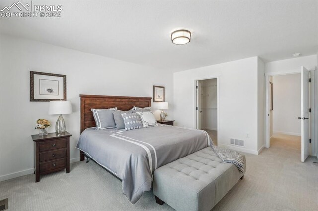 6913 Knapp Dr, Colorado Springs, CO 80924 - bedroom with light colored carpet, baseboards, and a spacious closet