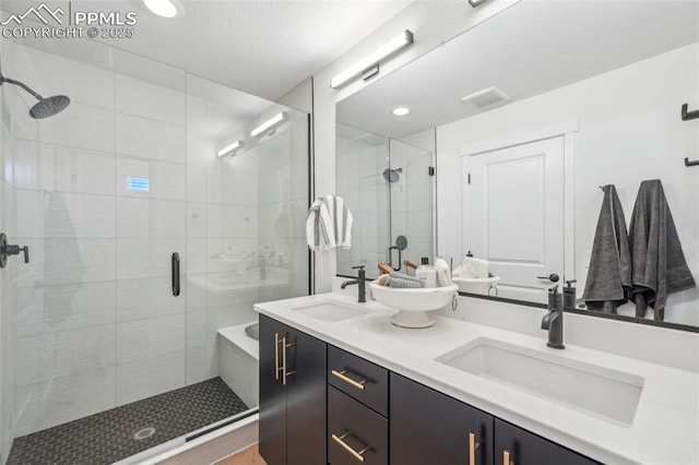 6913 Knapp Dr, Colorado Springs, CO 80924 - bathroom with a stall shower, double vanity, and recessed lighting