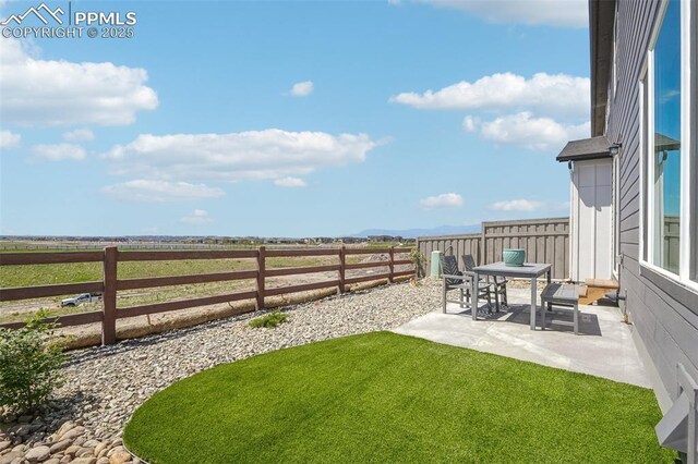 6913 Knapp Dr, Colorado Springs, CO 80924 - view of yard featuring a patio area and a rural view