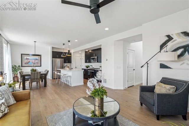6913 Knapp Dr, Colorado Springs, CO 80924 - living room featuring ceiling fan, light wood-style floors, and recessed lighting
