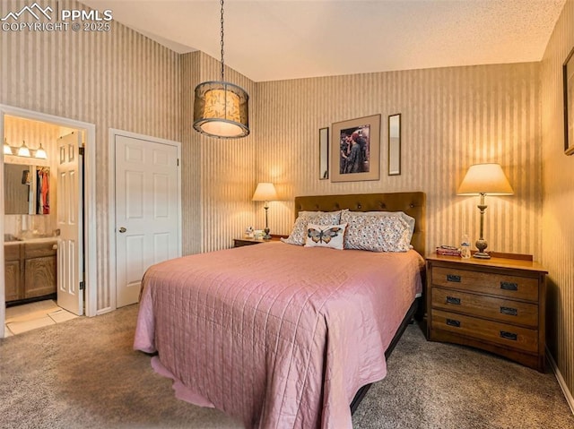 2186 Giltshire Dr, Colorado Springs, CO 80905 - bedroom with carpet, wallpapered walls, and connected bathroom