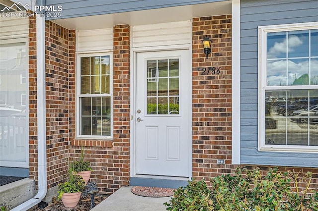 2186 Giltshire Dr, Colorado Springs, CO 80905 - doorway to property featuring brick siding and covered porch