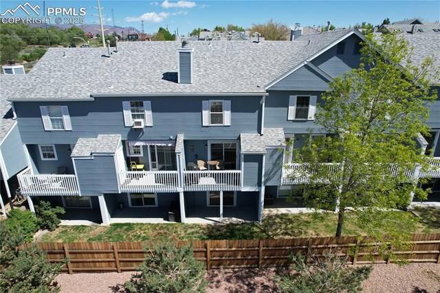 2186 Giltshire Dr, Colorado Springs, CO 80905 - rear view of property featuring a fenced backyard, a patio, and a chimney