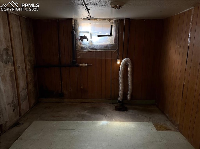 2531 Gunnison St, Colorado Springs, CO 80909 - basement with wooden walls and light flooring