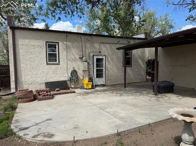 2531 Gunnison St, Colorado Springs, CO 80909 - back of property featuring stucco siding and a patio