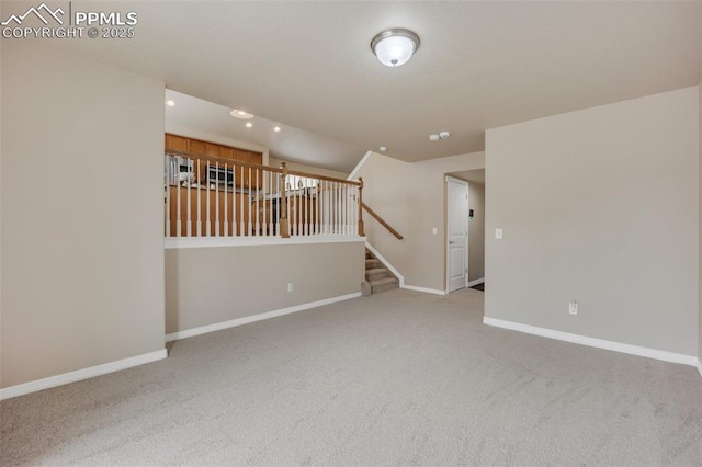 6259 Bearcat Loop, Colorado Springs, CO 80925 - carpeted spare room featuring recessed lighting, baseboards, and stairs