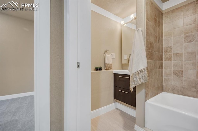 6259 Bearcat Loop, Colorado Springs, CO 80925 - bathroom with vanity, tub / shower combination, and baseboards