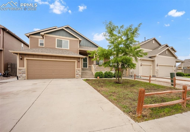 6259 Bearcat Loop, Colorado Springs, CO 80925 - craftsman inspired home with concrete driveway, stone siding, a garage, and a shingled roof