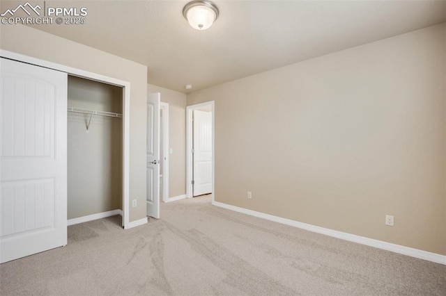 6259 Bearcat Loop, Colorado Springs, CO 80925 - unfurnished bedroom featuring light colored carpet, baseboards, and a closet