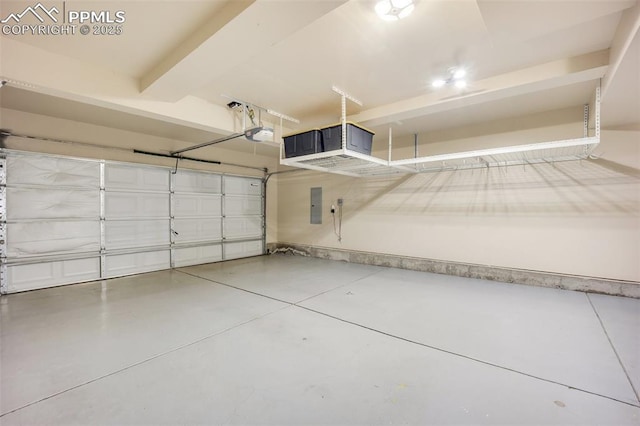 6259 Bearcat Loop, Colorado Springs, CO 80925 - garage featuring electric panel and a garage door opener