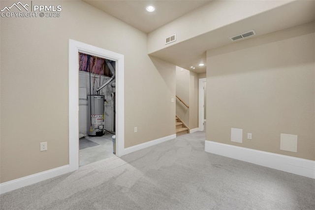6259 Bearcat Loop, Colorado Springs, CO 80925 - carpeted spare room with water heater, recessed lighting, stairway, and baseboards