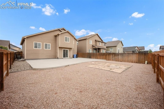 6259 Bearcat Loop, Colorado Springs, CO 80925 - rear view of house featuring a patio area, a fenced backyard, and a residential view