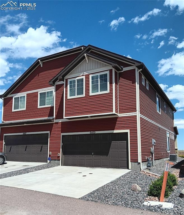 6459 Rockcorry Hts, Colorado Springs, CO 80927 - view of side of home featuring a garage, driveway, and central air condition unit