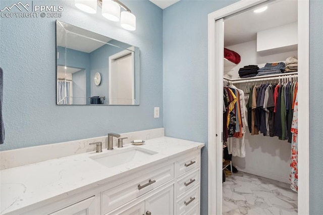 954 Fontmore Rd Unit B, Colorado Springs, CO 80904 - full bathroom with marble finish flooring, vanity, and a spacious closet