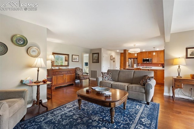 954 Fontmore Rd Unit B, Colorado Springs, CO 80904 - living area with dark wood-style floors and baseboards