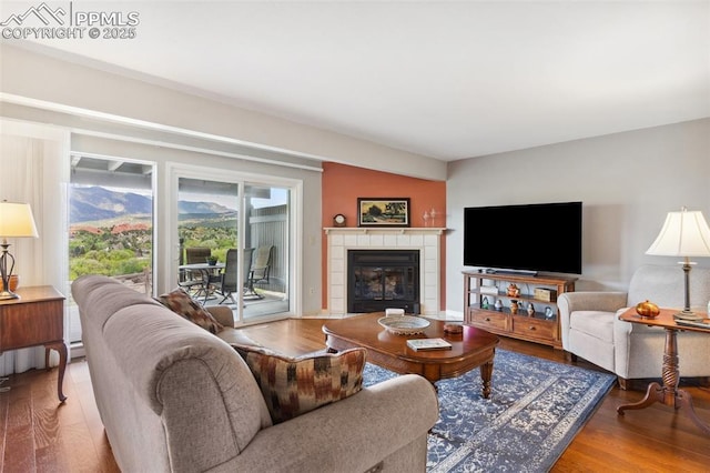 954 Fontmore Rd Unit B, Colorado Springs, CO 80904 - living room featuring wood finished floors and a fireplace
