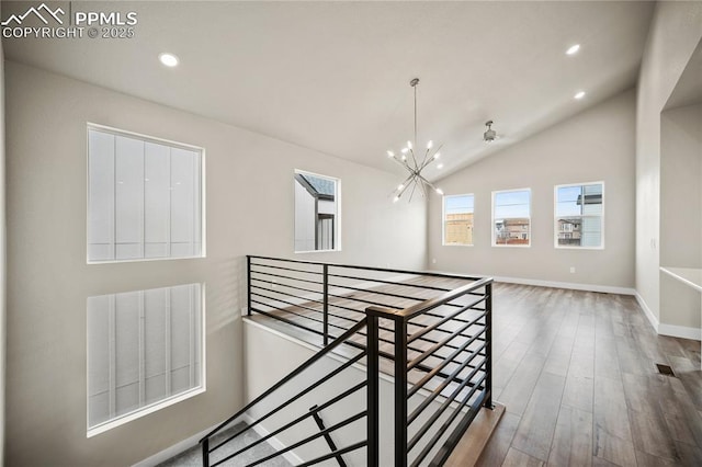 3065 Curly Grv, Colorado Springs, CO 80922 - corridor with an upstairs landing, a chandelier, recessed lighting, wood finished floors, and lofted ceiling