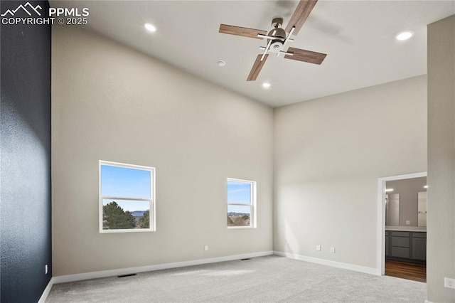 3065 Curly Grv, Colorado Springs, CO 80922 - spare room with a towering ceiling, a ceiling fan, carpet, recessed lighting, and baseboards