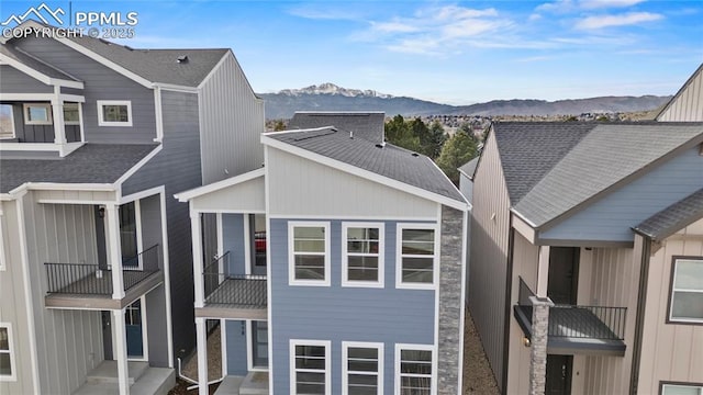 3065 Curly Grv, Colorado Springs, CO 80922 - view of property exterior featuring a balcony, a mountain view, and roof with shingles