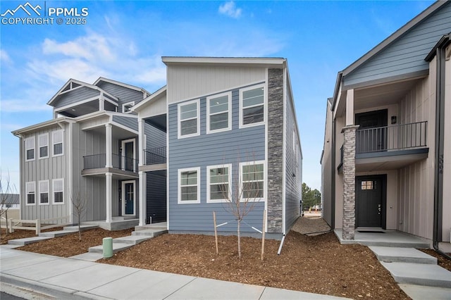 3065 Curly Grv, Colorado Springs, CO 80922 - view of front facade featuring a balcony and board and batten siding