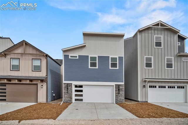 3065 Curly Grv, Colorado Springs, CO 80922 - view of front facade with an attached garage, stone siding, concrete driveway, and board and batten siding