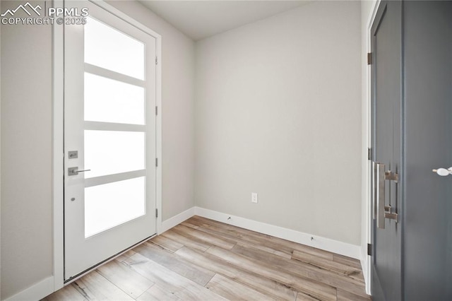 3065 Curly Grv, Colorado Springs, CO 80922 - entryway featuring light wood finished floors and baseboards