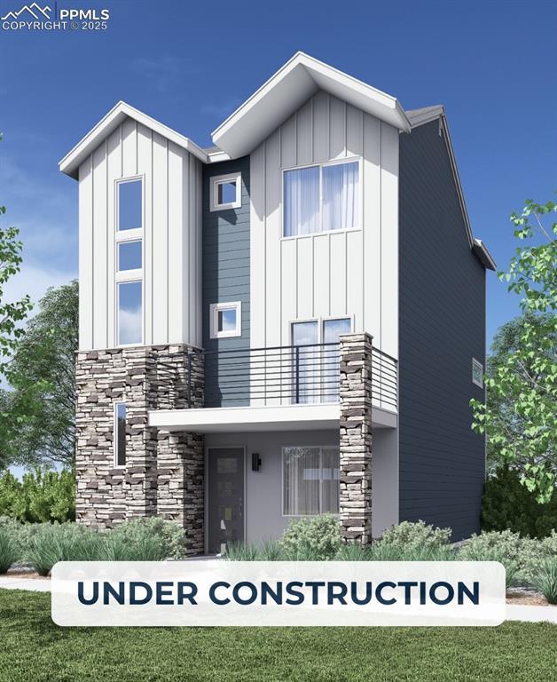 10794 Spalding Vw, Colorado Springs, CO 80908 - view of front of property featuring stone siding, a balcony, and board and batten siding