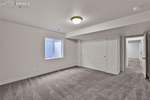 9095 Vanderwood Rd, Colorado Springs, CO 80908 - unfurnished bedroom with carpet floors, a textured ceiling, and a closet