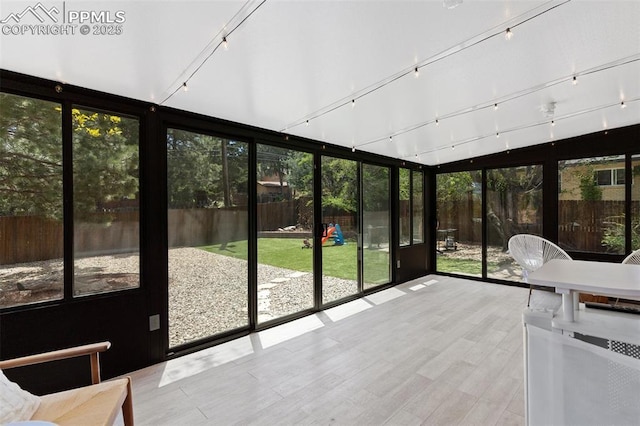 1107 Parkview Blvd, Colorado Springs, CO 80905 - unfurnished sunroom with a wall of windows and wood finished floors
