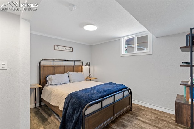 1107 Parkview Blvd, Colorado Springs, CO 80905 - bedroom featuring wood finished floors, baseboards, a textured wall, and a textured ceiling